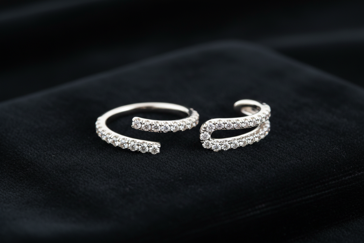 Pavé and micro-pavé diamond ear cuffs on black velvet