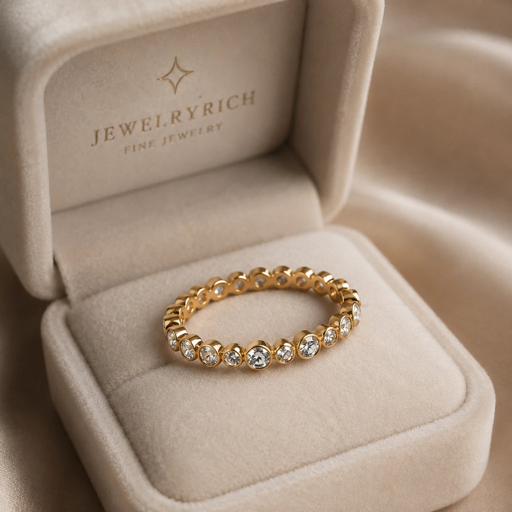 18K yellow gold bezel-set diamond eternity band in JewelryRich cream velvet ring box — Orbit Eternity Band, round brilliant diamonds, bridal fine jewelry