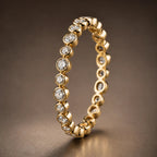 18K yellow gold bezel-set diamond full eternity wedding band — Orbit Eternity Band with alternating round brilliant diamonds and gold orbs, by JewelryRich Fine Jewelry