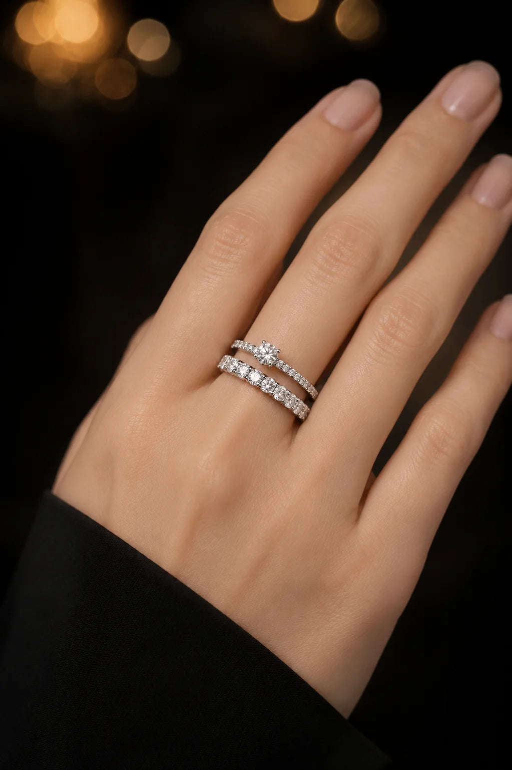 18K white gold full eternity diamond wedding band on hand with golden bokeh background, continuous pavé diamonds, JewelryRich