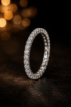 18K white gold full eternity diamond wedding band flat lay, continuous brilliant-cut GIA certified diamonds, dark luxury editorial, JewelryRich