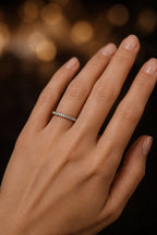 Thin minimal micro-pavé diamond wedding band worn on hand, 18K white gold ultra-slim profile, JewelryRich