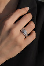 Vintage filigree three-stone diamond wedding band worn on hand, 18K white gold Art Deco style, JewelryRich