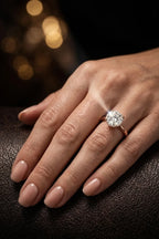 Hidden halo diamond engagement ring worn on hand in 18K rose gold — floating diamond illusion effect | JewelryRich