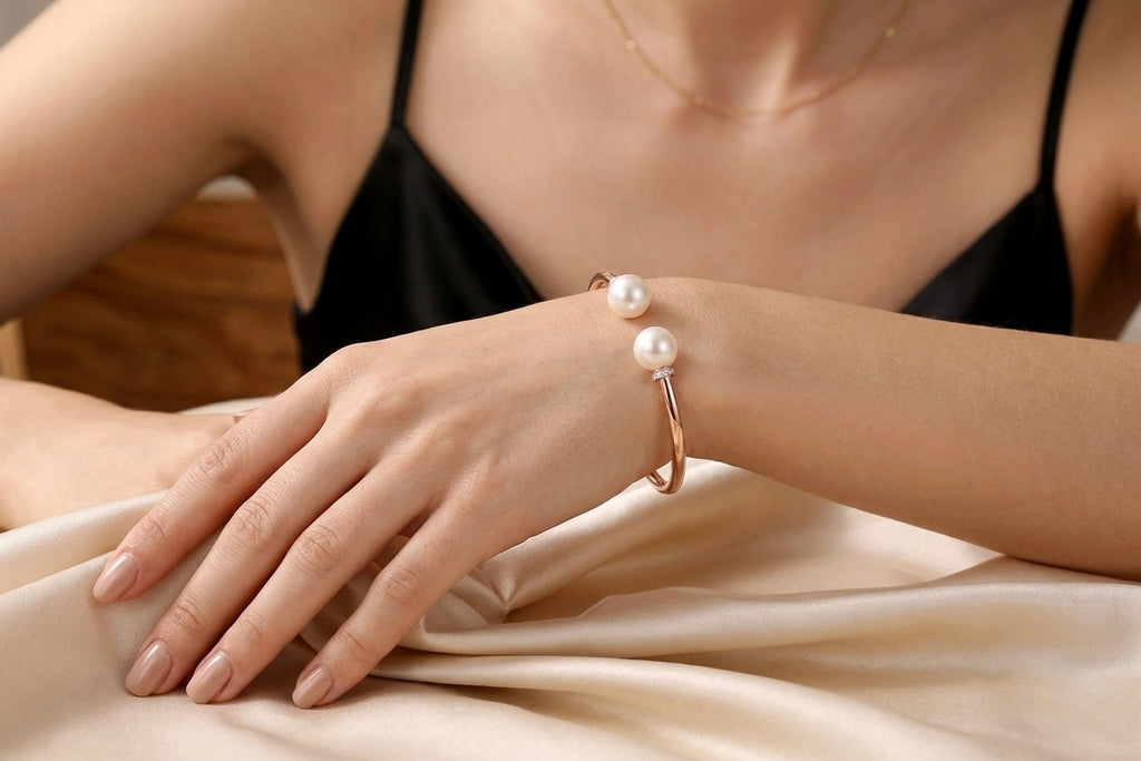 Pearl Duet Cuff 14K Rose Gold freshwater pearl diamond bangle worn on wrist – lifestyle photo