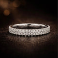 18K white gold pavé diamond wedding band, continuous round brilliant diamond setting, slim comfort-fit profile, JewelryRich