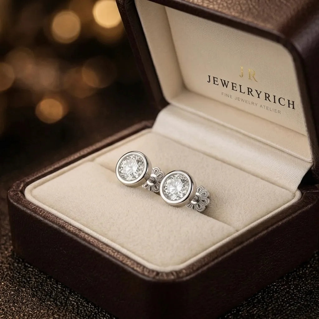 Bezel-set diamond stud earrings in 18K white gold displayed in JewelryRich signature gift box