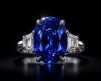Platinum Kashmir sapphire ring showing diamond side stones and prong setting on PT950— fine jewelry investment piece