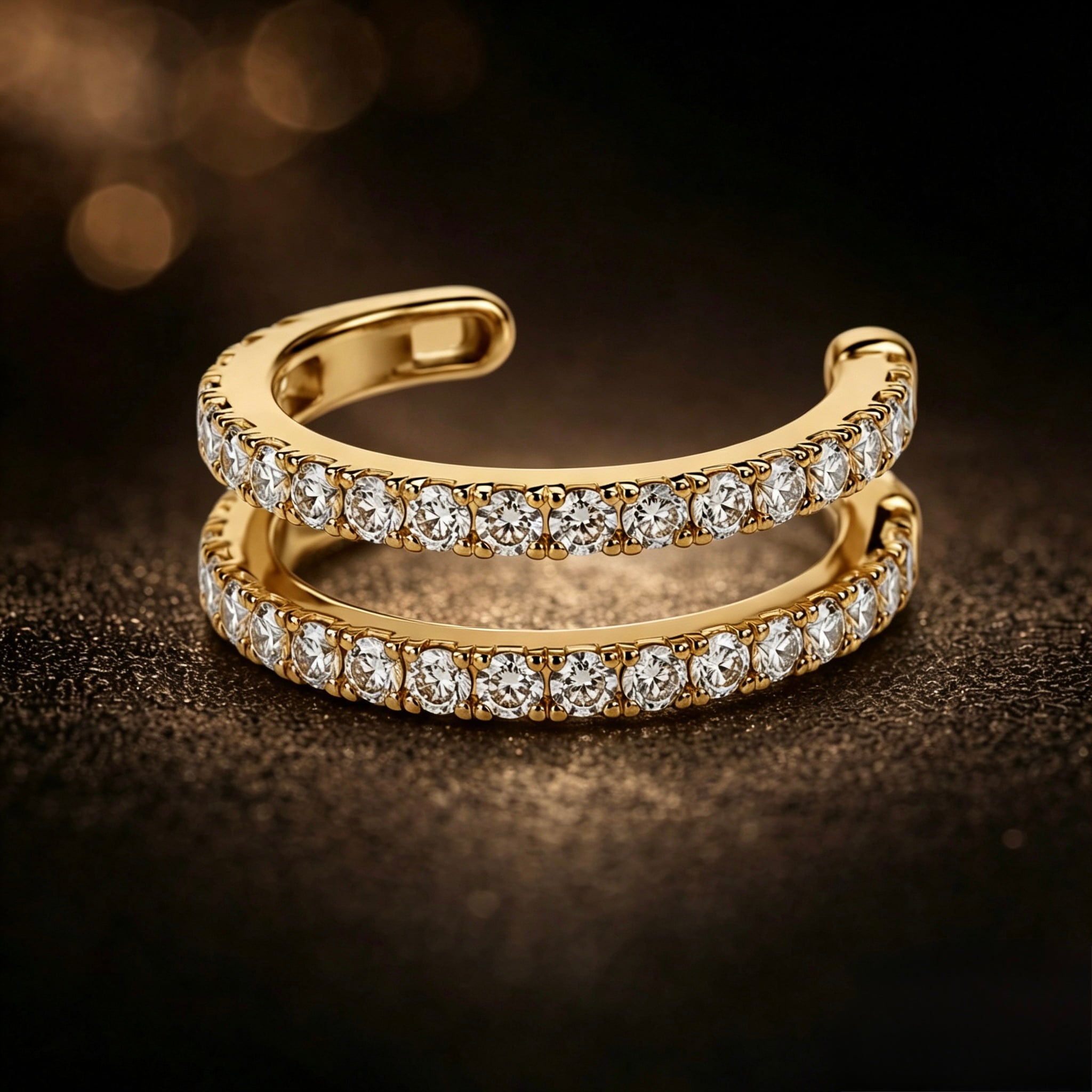 Diamond pavé double row ear cuff in 18K yellow gold – dark luxury editorial close-up showing diamond brilliance | JewelryRich