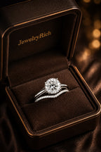 Hidden halo diamond engagement ring and contoured pavé wedding band in JewelryRich luxury jewelry box — 18K white gold bridal set