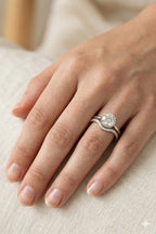 Hidden halo diamond engagement ring and contoured wedding band bridal set on hand, brilliant-cut GIA certified diamonds in 18K white gold, JewelryRich