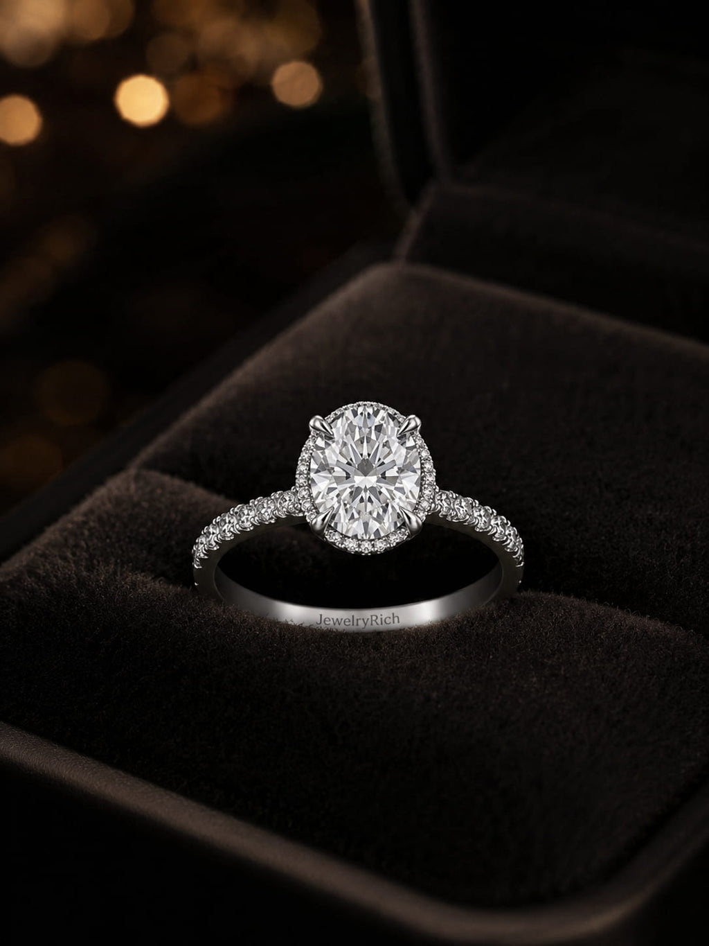 Hidden halo oval diamond engagement ring in black velvet jewelry box, 18K white gold, brilliant micro-pavé halo setting, GIA certified, JewelryRich