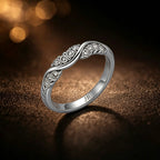White gold Infinity Band wedding ring with brilliant-cut diamonds in a contoured weave setting.