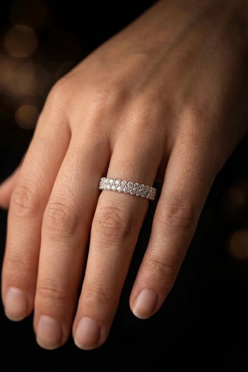 18K white gold pavé diamond wedding band worn on hand, continuous diamond setting, JewelryRich