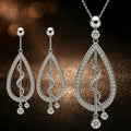 Platinum Jewelry Set, teardrop diamond earring and matching nekclace with swirling design for special occasions