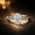 Vintage-inspired oval diamond hidden halo engagement ring in platinum, heirloom design with milgrain detail, JewelryRich